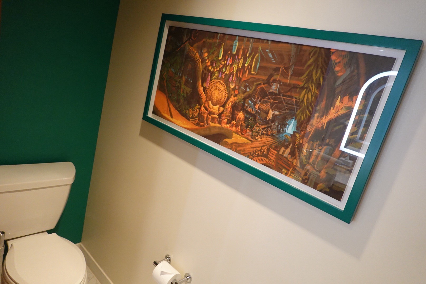 トイレの壁に飾られたプリンセスと魔法のキスをモチーフにした絵画